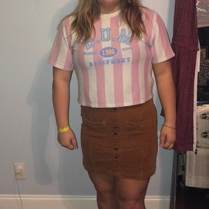 A crop shirt and a skirt together